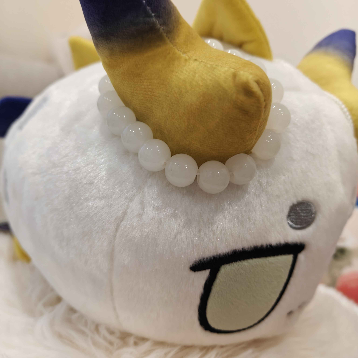 Arknights Shu bean plush doll side view showing Left Horn Details