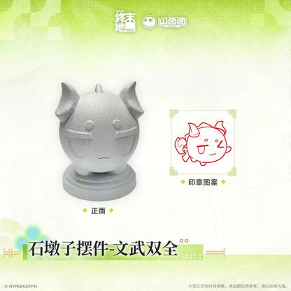 Arknights Endfield Bollard Desk Statue Stamp front view, shown next to its red stamp design of a smiling, winking bean
